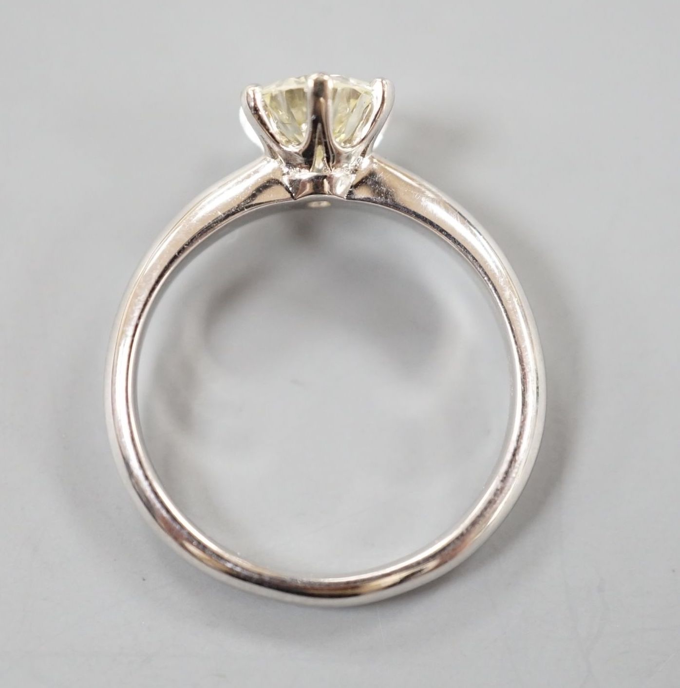 A modern 18k white metal and solitaire diamond set ring, size M, gross weight 3.6 grams